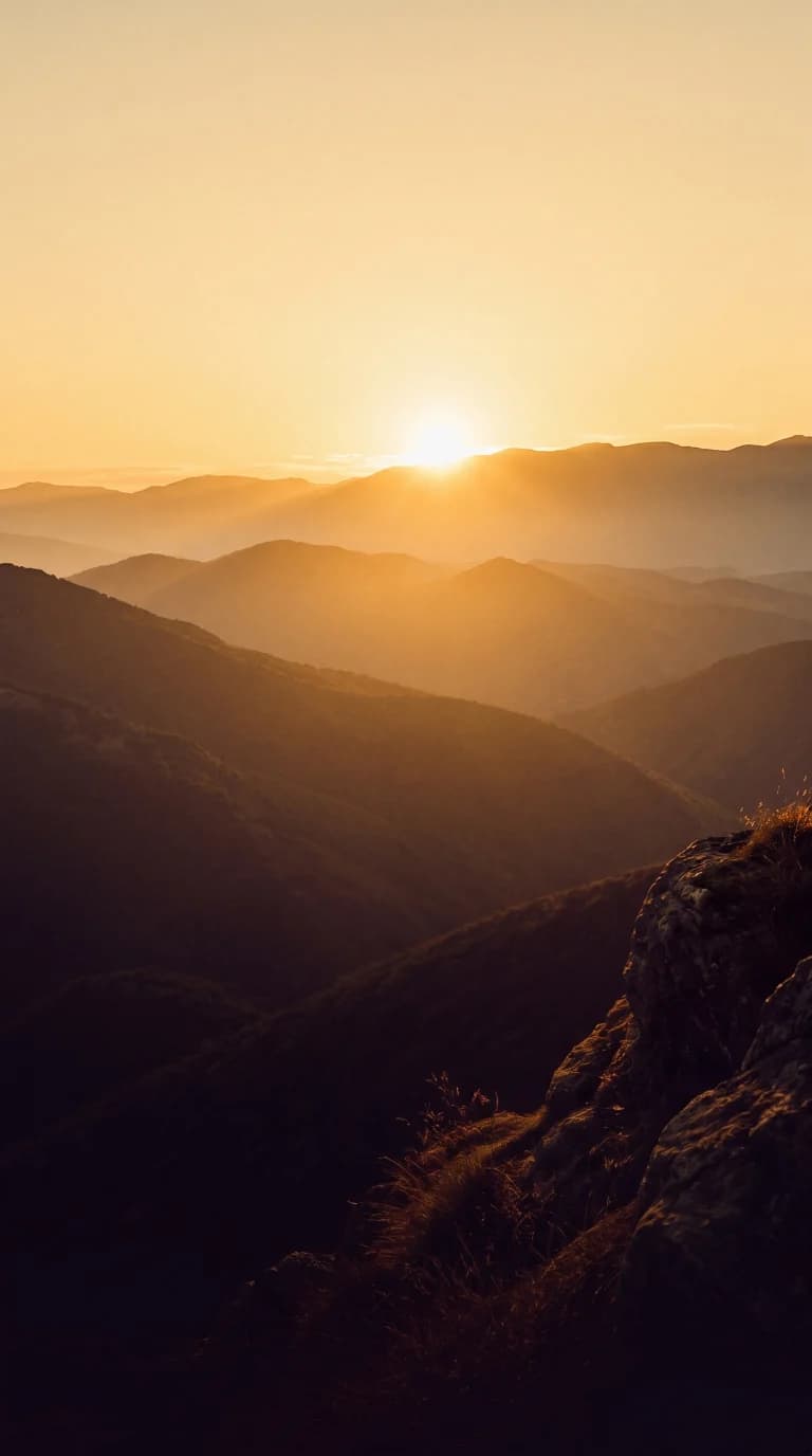 Golden sunrise over mountain ridges